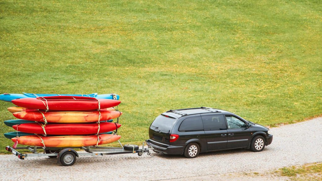Car towing canoe with hitch