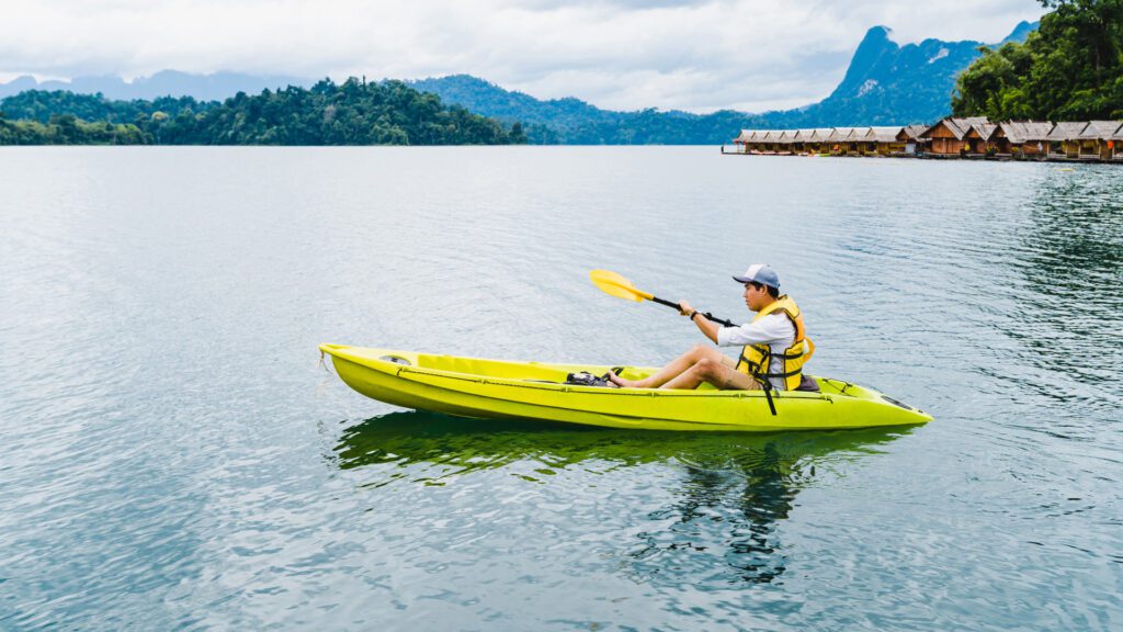 Man on a yellow color kayak