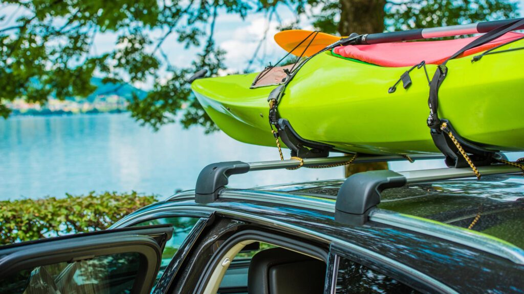 A Canoe On A Vehicle With A Roof Rack