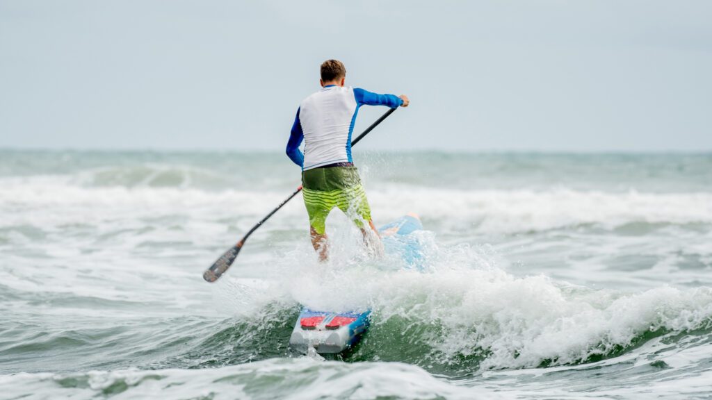 Man on a racing paddle board SUP
